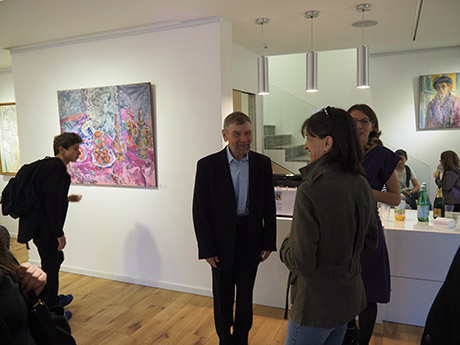 Nikolai Kuzmin is present, discussing with the visitors