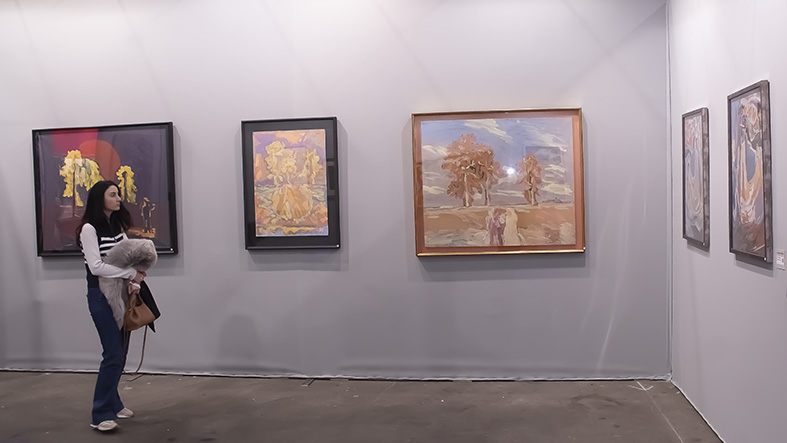 A visitor to ephemeral Grand Palais looks at the mini-exhibition of 5 works, by Nikolai Kuzmin at the Watercolour and Drawing annual exhibition (Art Capital 2024).