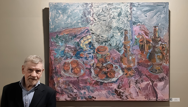 Nikolai Kuzmin at the Comparisons annual exhibition 2023 (Art Capital 2023), at ephemeral Grand Palais, Paris, next to his painting: Still life, O/C, H 100 x W 120 cm (H39.4”xW47.2”), 2015